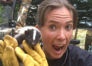 Christie holding a juvenile skunk